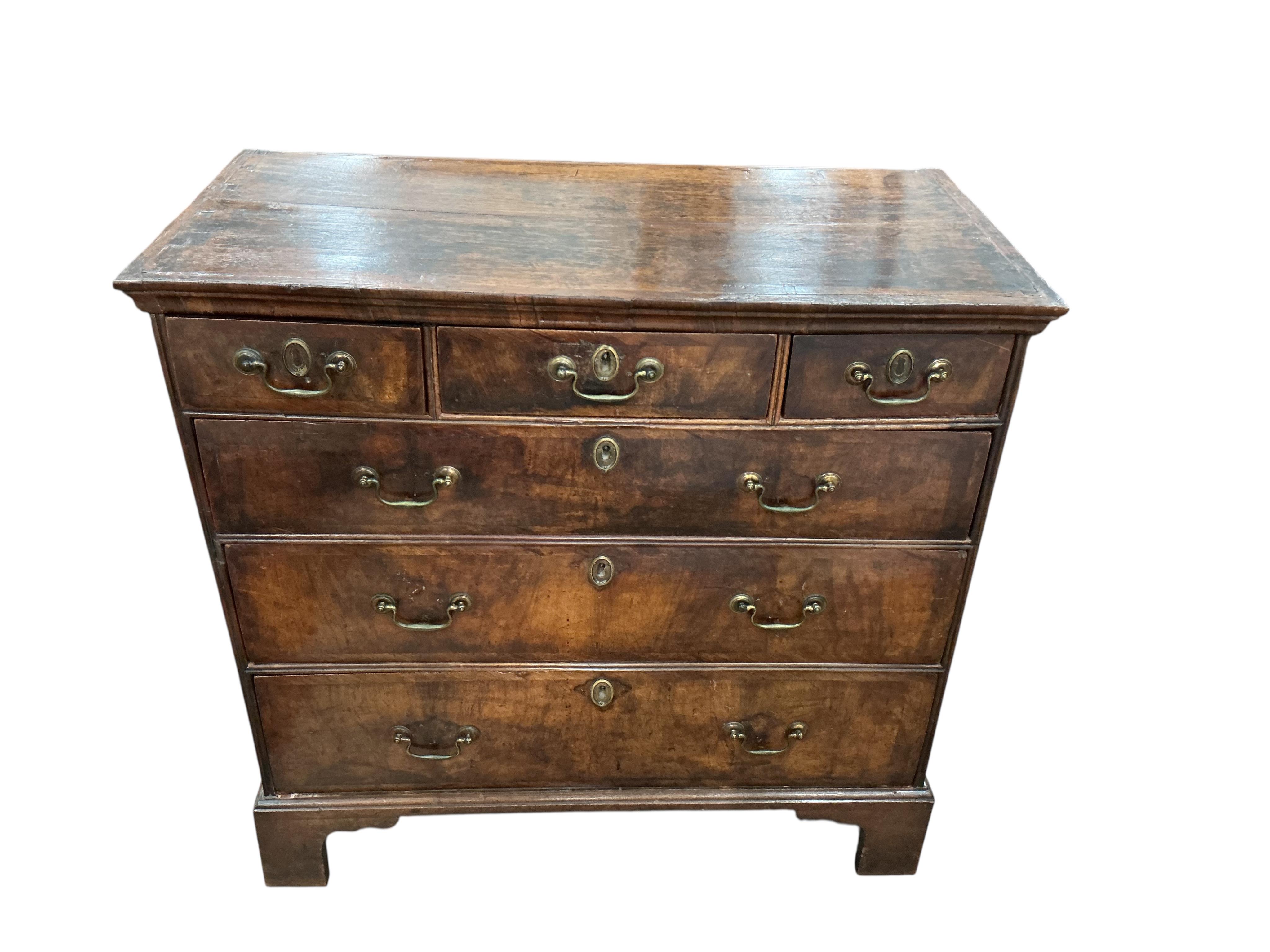 An 18th century oak and walnut chest, width 98cm, depth 49cm, height 94cm